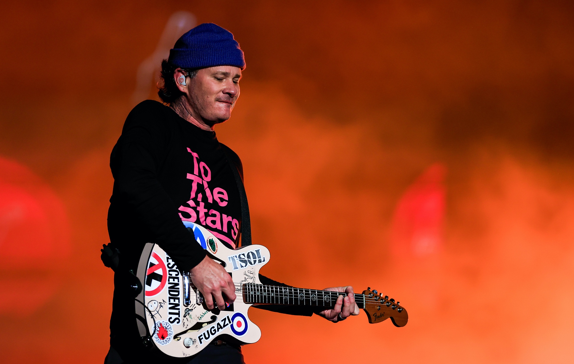 Tom DeLonge performing live on stage with Blink-182