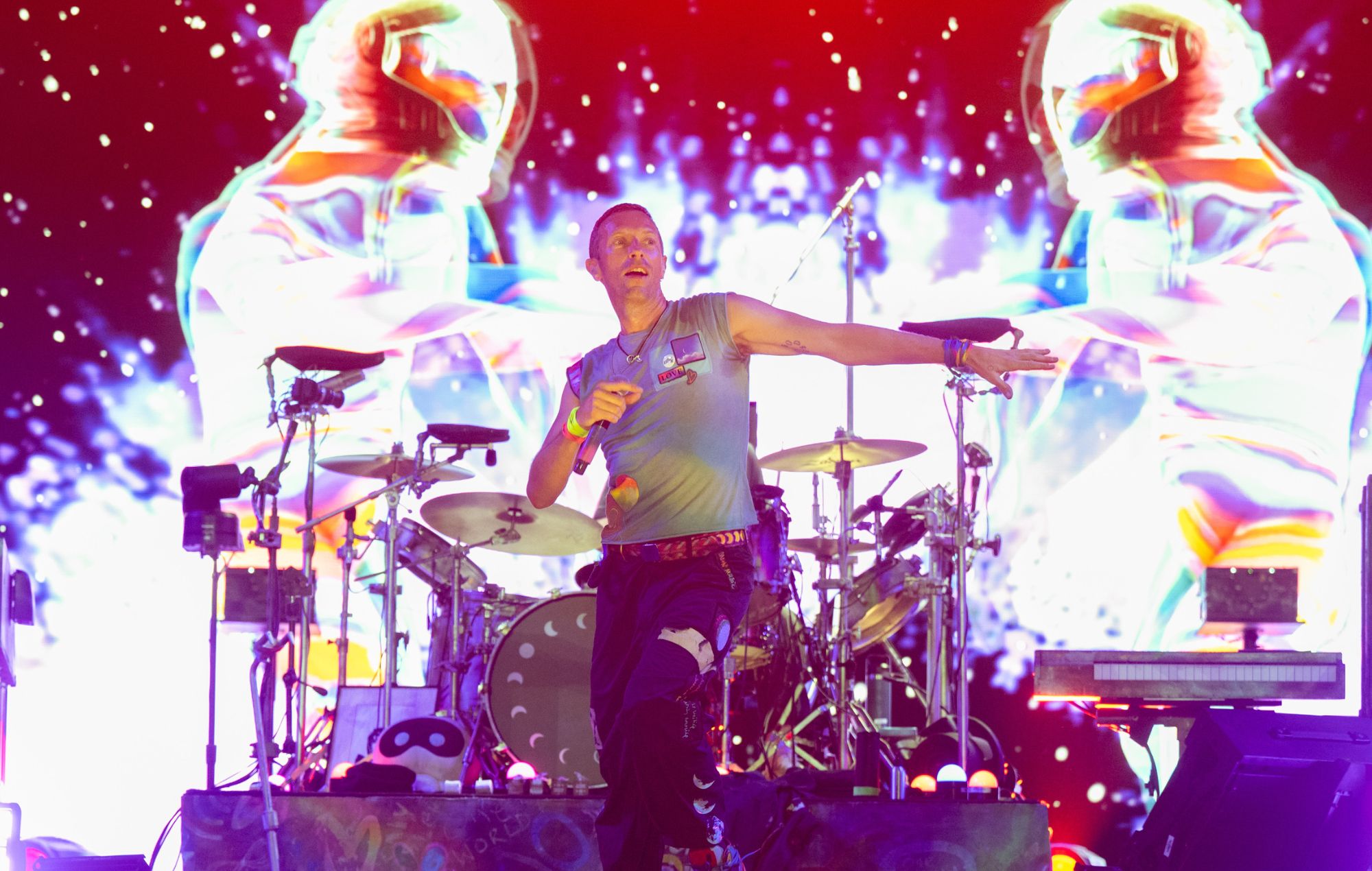 Chris Martin of Coldplay performs at Glastonbury Festival 2024.