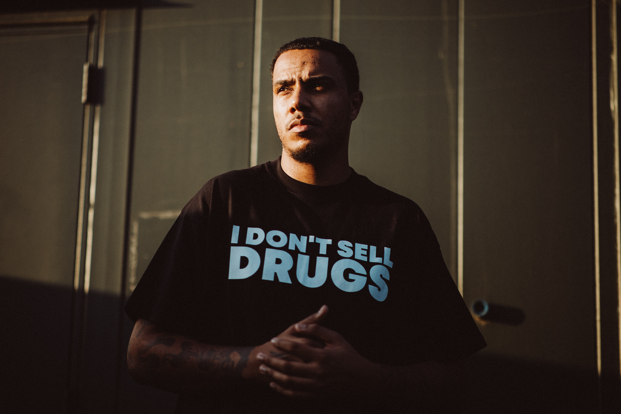 AJ Tracey backstage at Reading Festival 2025. Photo credit: Andy Ford for NME.