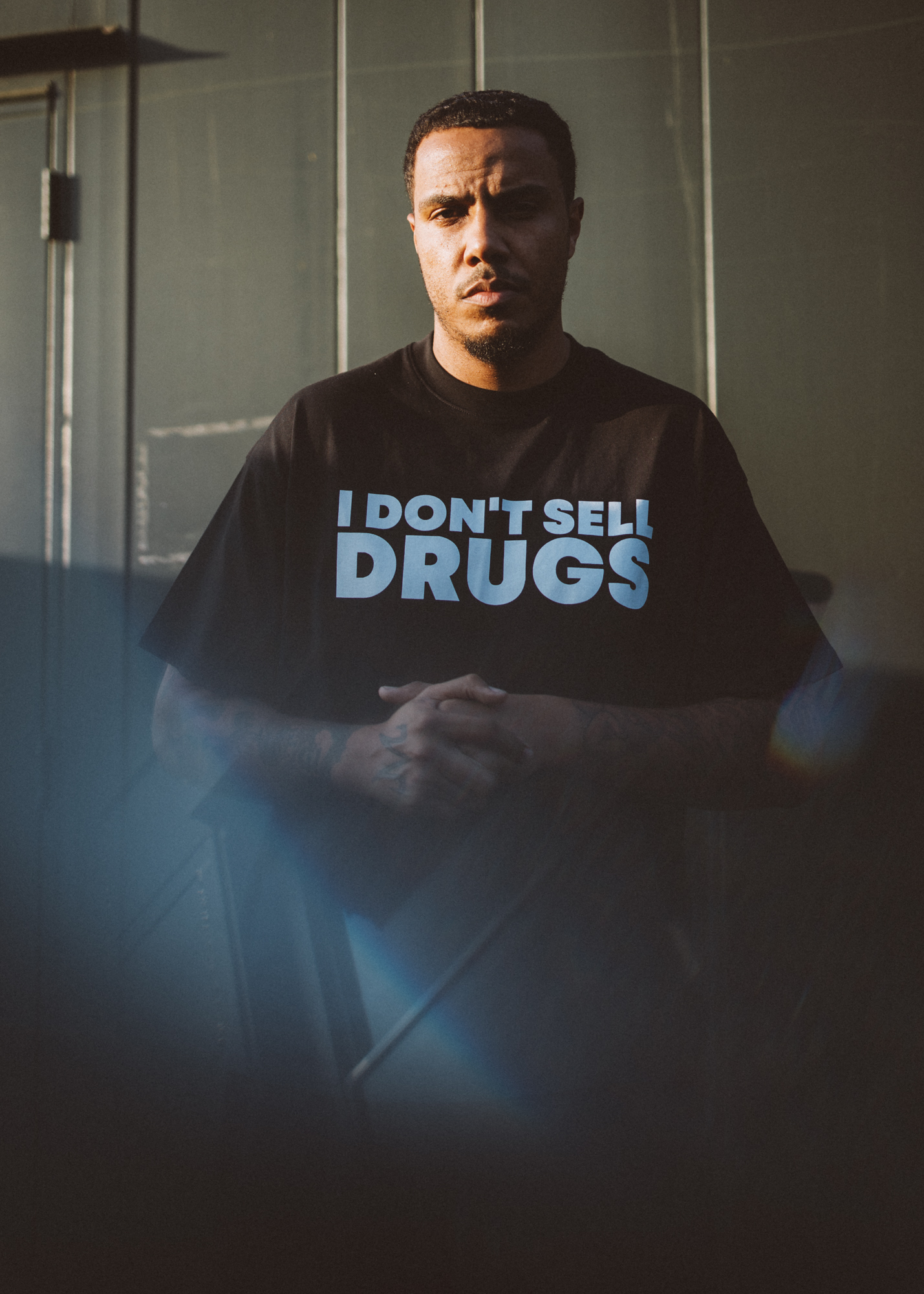 AJ Tracey backstage at Reading Festival 2025. Photo credit: Andy Ford for NME.