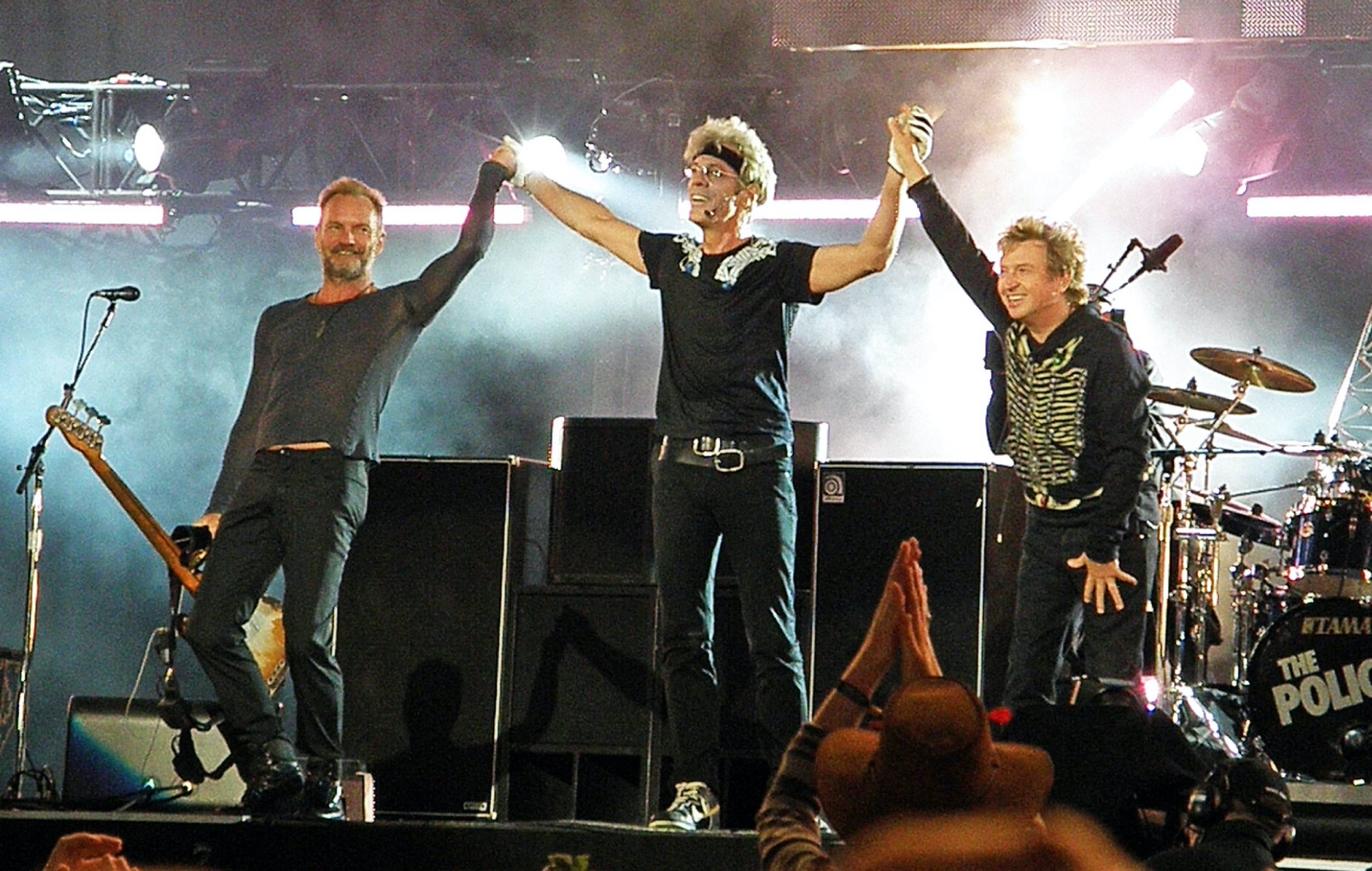 Sting, Stewart Copeland and Andy Summers on stage as The Police in 2008, photo by Pete Still/Redferns/Getty