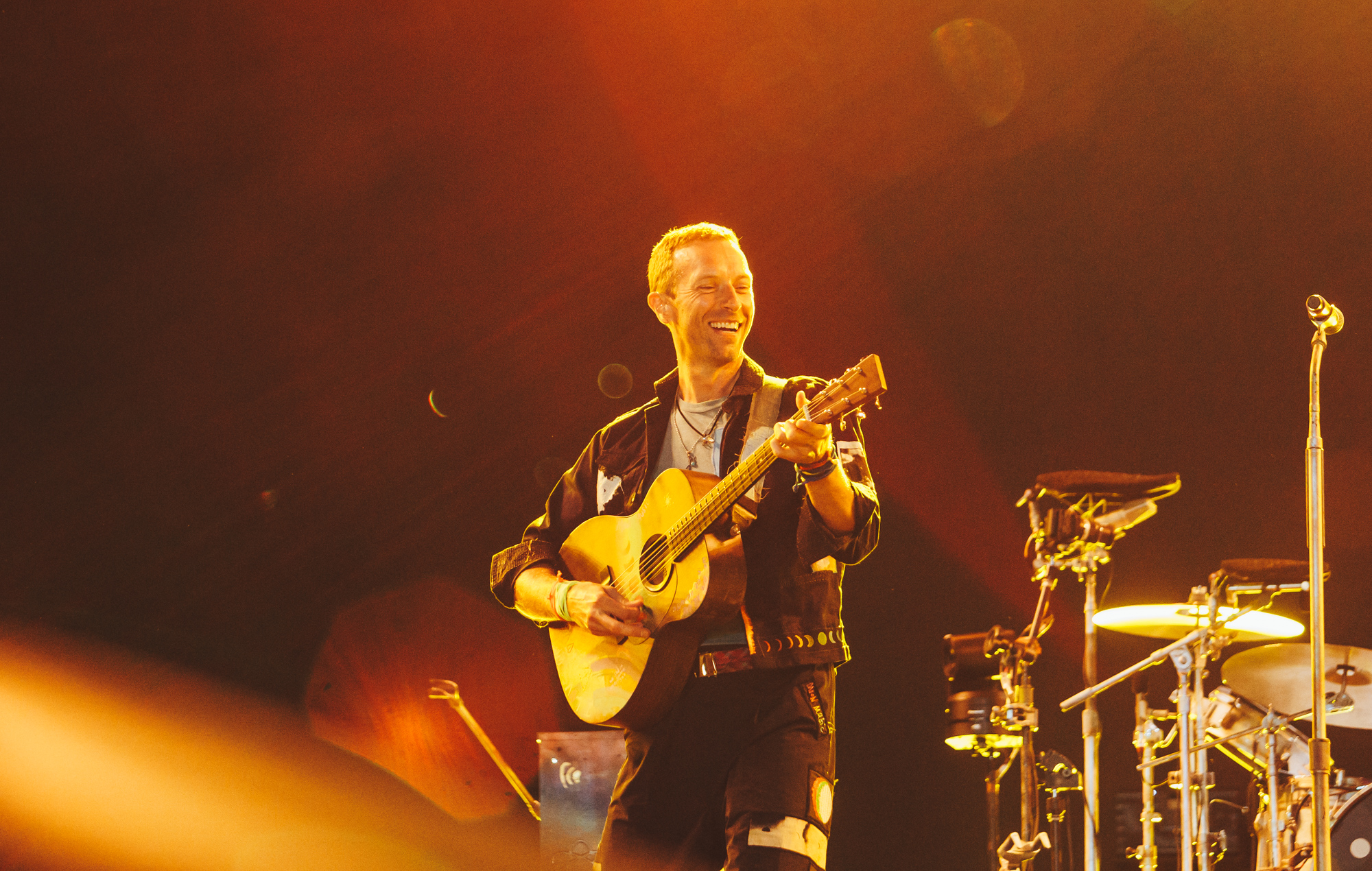 Chris Martin of Coldplay live at Glastonbury 2024, photo by Andy Ford